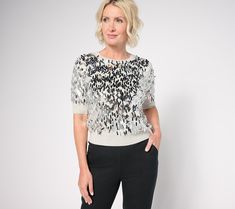 Whether you're attending a holiday party or the new restaurant that just opened downtown, arrive in showstopping style when you don this sequin sweater. Stand out from the crowd in this sparkly top and be best dressed on the guest list -- it's your time to shine. From Isaac Mizrahi Live!TM. Elegant Sequined Sweater For Fall, Fall Party Crew Neck Knit Top, Fall Party Knit Top With Crew Neck, Winter Contrast Sequin Tops, Fitted Knit Top For Winter Party, Winter Tops With Contrast Sequin, Fitted Knit Top For Fall Party, Fitted Crew Neck Knit Top For Party, Fitted Knit Top For Party With Crew Neck