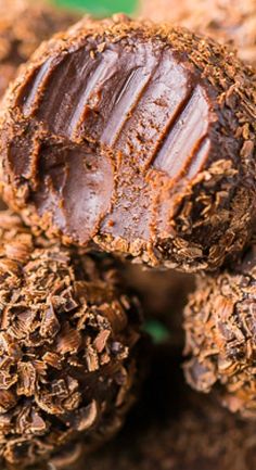 closeup of chocolate truffles on top of each other in the dirt