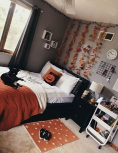 a bed room with a neatly made bed and lots of decorations on the wall above it