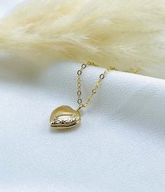 This heart shaped photo locket is very cute and delicate perfect for everyday wear. Dainty heart locket, Minimalist heart locket, Vintage photo locket necklace, Love locket necklace, medallion locket, Small heart locket, Gold heart locket, gift for her  -------------------------------------- DETAILS  * Locket material: 18k gold plated  * Size: 10.5mm x 12mm * Chain Material: 14k gold filled  * Chain length: Choose from drop down menu  * Chain style: Cable, Satellite, Paperclip  * Choose Your favorite style from drop down menu  SHIPPING  * Free domestic shipping on all orders  PACKAGING  * All pieces comes beautifully and carefully packaged in a jewelry box  * Feel free to ask any questions regarding this item! Thank you 🌸 Dainty Pendant Locket Necklace, Dainty Heart Locket Necklace Gift, Everyday Heart Locket Necklace For Valentine's, Dainty Everyday Locket Necklace, Dainty Locket Necklace For Everyday, Dainty Heart Locket Necklace With Delicate Chain, Dainty Heart Pendant Locket Necklace With Delicate Chain, Heart Shaped Dainty Locket Necklace With Delicate Chain, Dainty Heart Pendant Locket Necklace Gift