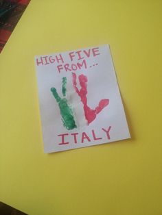 a piece of paper that says high five from italy with handprints on it