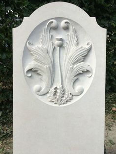 a white monument with an ornate design on it