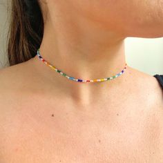 Click here for this dainty seed bead rainbow necklace. This handmade mixed color seed bead necklace is everything you need to show your pride. 🏳️🌈This necklace includes an assortment of small seed beads. The necklace can be purchased in different lengths to go perfect with your look. The necklace includes an extender that allows for you to layer it perfectly with all of your necklaces. The listing is for a single beaded necklace. Shop our matching anklet: https://www.etsy.com/listing/130553825 Minimalist Bead Necklace, Dainty Rainbow Round Beaded Jewelry, Dainty Multicolor Necklace For Jewelry Making, Trendy Rainbow Beaded Necklaces With Round Beads, Dainty Beaded Necklace With Tiny Beads For Festivals, Minimalist Beaded Necklace With Letter Beads, Minimalist Beaded Necklace With Round Letter Beads, Trendy Rainbow Beaded Necklace With Round Beads, Multicolor Dainty Beads For Jewelry Making