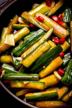 cucumbers and peppers are cooked in a pan