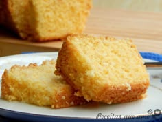 three pieces of cake sitting on top of a cutting board