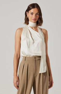 Attached scarf detail asymmetric top Pull on style Dry clean only 100% Viscose Style #ACT18422 Asymmetric Top, Astr The Label, Dresses By Length, Asymmetrical Tops, Satin Top, Spring Tops, One Shoulder Tops, Tie Neck, Model Height