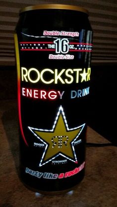 a rock star energy drink can sitting on a table