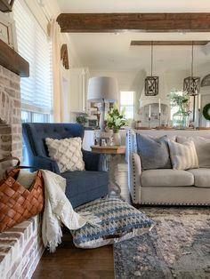 a living room filled with furniture and a fire place