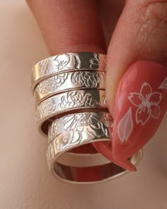 Hand Stamped Birth Flower Wide Ring Bands SOLD INDIVIDUALLY  Sterling Silver or 14K Gold Filled  Width: 4mm Size 4-12 These birth flower designs are all hand stamped one by one so they are one a kind and unique. It may not look perfect meaning the designs may vary slightly from the photos attached. Each design is hand stamped so the flowers may be overlapped or may not be completely stamped. Please note that you are purchasing a handmade piece and not a machine made piece so be open to the ring Perfect Meaning, Ring Bands, Stamped Rings, Wide Ring, Funky Jewelry, Jewelry Lookbook, Birth Flower, Birth Flowers, Dream Jewelry