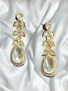 Beautiful uncut polki vintage earrings with gold diamond work and a modern luxurious look for any jewelry lover! The earrings are inspired by the royal princely states of rajasthan and have handwork done with diamond work added for a luxurious look! This lightweight and elegant earring is perfect for any bridesmaid, bride, sangeet or any occasion or event as a gift for any occasion as any one who loves jewelry will love this statement piece. It has beautiful colors that really make the set a statement piece. There are 4 colors available in these earrings and each of them are made with the highest quality stones. Product Details: * Earrings  Ready to Ship and available immediately if you place an order today! Fast Shipping US Customers receive your order within 5-7 business days. This is th Luxury Gold Plated Bridal Earrings With Meenakari, Luxury Gold Jhumkas With Stone Work, Luxury Hand Set Bollywood Earrings, Bollywood Diamond Gold Jhumkas, Bollywood Gold Diamond Jhumkas, Bollywood Style Gold Diamond Jhumkas, Bollywood Style Diamond Gold Jhumkas, Gold Diamond Jhumkas For Festivals, Gold Diamond Jhumkas For Reception