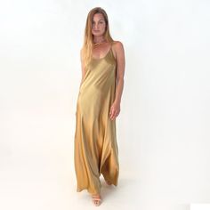 This dress is made of 100% silk charmeuse fabric. It is heavy weight, and not see-through. It is cut on the bias, which allows for its natural give and flow. Although lightweight, this garment has a lush look about it. And there is (almost) nothing as sensuous as silk against the skin!  Size S/M its dress sizes 4-10 Total Length of body without the straps (straps are adjustable) - 57 inches SHOP OUR NEW DESIGNS AT VACANCESCOLLECTION.COM Floor-length Satin Dress With Bias Cut For Evening, Floor-length Bias Cut Satin Evening Dress, Silk Dress With Satin Lining For Summer, Floor-length Modal Satin Slip Dress, Satin Bias-cut Evening Dress, Floor-length Satin Evening Dress, Floor-length Silk Dress With Satin Lining, Modal Satin Bias Cut Maxi Slip Dress, Floor-length Satin Slip Dress For Summer