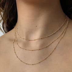 14k gold filled beaded dainty chain. Perfect to layer with any of your favorite necklaces. Dainty Double Strand Chain Necklace, Gold Layered Necklace With Delicate Chain And Round Beads, Delicate 14k Gold Filled Charm Necklaces For Layering, Minimalist Beaded Chain Layered Necklace, Minimalist Everyday Beaded Chain Layered Necklace, Dainty Layered Necklace With Satellite Chain, Gold Ball Chain Necklaces For Layering, Delicate Everyday Jewelry With Ball Chain, Dainty Charm Necklace For Layering