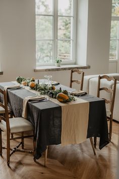 the table is set with black and white linens