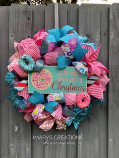 a pink and blue wreath that says don't touch my christmas