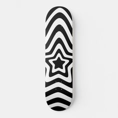 a skateboard with black and white designs on the bottom, against a white background