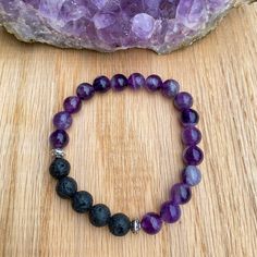 "This bracelet features gorgeous Dream Amethyst gemstones, lava stones, and Tibetan silver accent beads. Made with high quality elastic cord. Beads are 8mm, which is slightly larger than the size of a pea. *To use as a diffuser bracelet, apply a drop or two of 100% pure essential oil to the lava stones. The scent will last for 1-2 days. Amethyst Healing Properties: Protection, Cleansing, Intuition, Clears Negativity & Confusion Amethyst is the February birthstone. Lava rock is known for its grou Spiritual Stone Bracelets Gift, Spiritual Bracelets With Stones For Gift, Spiritual Stones Bracelet Gift, Adjustable Crystal Bracelet With Stones For Meditation, Spiritual Lava Stone Stretch Bracelet Gift, Adjustable Stone Beaded Bracelets For Meditation, Adjustable Beaded Bracelets With Stones For Meditation, Lava Stone Bracelets With Gemstone Beads As A Gift, Lava Stone Bracelets With Gemstone Beads For Gifts