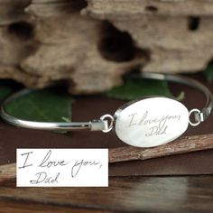 Actual Handwriting Bangle Bracelet, Silver Handwriting Jewelry, Personalized Engraved Bracelet, Memorial Bracelet, Gift for Her, Sympathy Gift This laser engraved Stainless Steel bangle bracelet is a perfect gift for your Mom, Best Friend or Bridesmaids! or anyone you choose! Personalized with actual handwriting. This is engraved into high quality heavy gauge stainless steel. Engravable Portion: 15mm x 24mm METAL COLOR OPTIONS: ROSE GOLD, SILVER, GOLD Stainless Steel does NOT tarnish. How to ord Personalized Engraved Bangle, Engraved Name Bangle Bracelet As Gift, Engraved Bangle Bracelet For Personalized Gift, Anniversary Bracelet With Engraved Text, Engraved Bangle Jewelry As A Gift, Meaningful Engraved Bracelets For Mother's Day, Engraved Bangle Bracelets For Gifts, Engraved Bangle Jewelry For Gifts, Adjustable Engraved Bangle For Personalized Gift