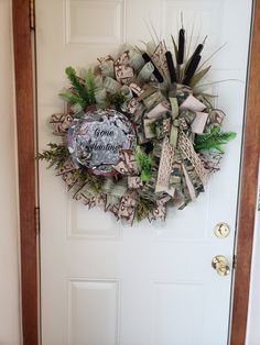 a wreath is hanging on the front door