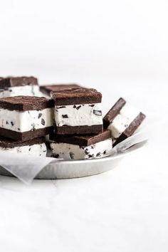 chocolate and white ice cream sandwiches on a plate