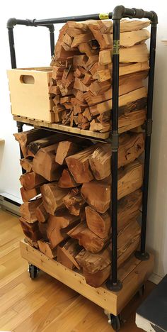 a large stack of wood sitting on top of a wooden floor