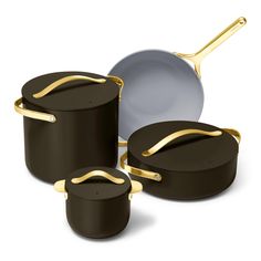 an assortment of pots and pans with gold handles