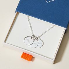 Our Men's Personalised Name Necklace is the perfect way for him to represent the most precious names in his special story. Hand-engrave each shiny disc with the names of his little ones, with up to five discs easily added as his family grows.&nbsp;925 Sterling SilverCharm: 1.5 x 1.5cm, 1mm thickChain length: 60 cmSecure clasp fasteningHand-engraved in our Paris workshopSent with love in a complimentary gift boxAny slight variations in lettering depth, spacing and alignment from the examples shown are part of the aesthetic and originality of the piece Silver Jewelry With Engraving Option For Birthday, Father's Day Engraved Sterling Silver Charm Necklaces, Engraved Sterling Silver Charm Necklaces For Father's Day, Father's Day Engraved Sterling Silver Charm Necklace, Silver Charm Necklace For Personalized Gift, Silver Round Disc Charm Necklace For Personalized Gift, Sterling Silver Name Necklace With Engraving Option, Sterling Silver Pendant Name Necklace With Engraving, Silver Sterling Name Necklace With Engraving Option