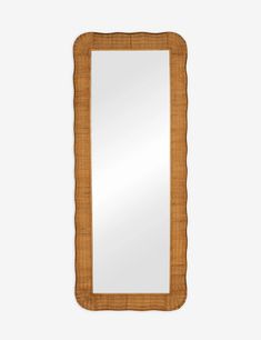 a wooden mirror hanging on the wall