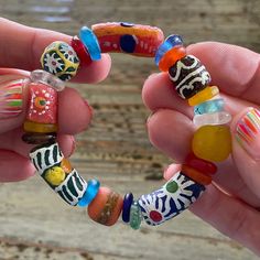 "Handmade African Glass Beaded Bracelets, Beautiful, Colorful 7\" African Trade Bead Bracelet This is made from African Trade Beads, none are perfect or exactly the same.  Trade beads are beads that were used as a medium of barter within and amongst communities. They are considered to be one of the earliest forms of trade between members of the human race. Size: All bracelets are about 7\" Beads: Huge Range please see all pictures  *If you don't see what you want or need a different size, message me! I am happy to custom make a bracelet for you!  Note: colors may differ depending on your monitor www.BettysGlassBeads.Etsy.com" Colorful Oval Beads Bracelets For Beach, Colorful Oval Beads Bracelet For Beach, Colorful Oval Beaded Bracelets For Beach, Bohemian Glass Stretch Bracelet With Colorful Beads, Multicolor Beaded Glass Bracelets, Multicolor Beaded Bracelets With Oval Beads, Spiritual Stretch Bracelet With Large Beads For Beach, Beach Beaded Bracelets With Large Oval Beads, Bohemian Colorful Beaded Bracelet With Large Beads