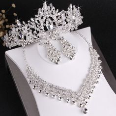 a tiara and earrings are on display