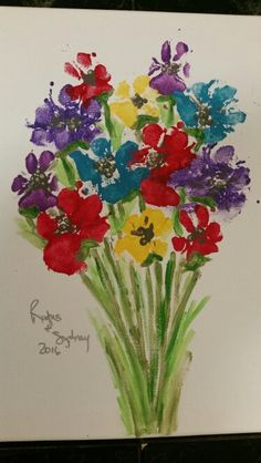 a painting of colorful flowers on white paper