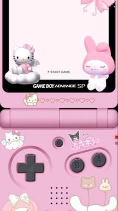 a pink nintendo wii game console with hello kitty stickers on it