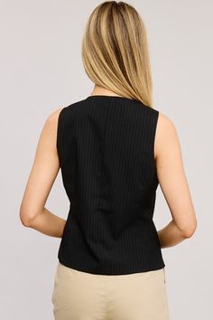 All-over pinstripe pattern round-neck, buttoned waistcoast vest sleeveless top, with regular length-fit and split hem. 69% POLYESTER 29% RAYON 2%SPANDEX Pinstripe Vest For Work, Elegant Pinstripe Sleeveless Vest, Elegant Black Top With Vertical Stripes, Fitted Sleeveless Top With Vertical Stripes, Formal Striped Sleeveless Vest, Pinstripe Sleeveless Tops For Work, Sleeveless Pinstripe Tops For Work, Striped Sleeveless Elegant Tops, Elegant Striped Sleeveless Top