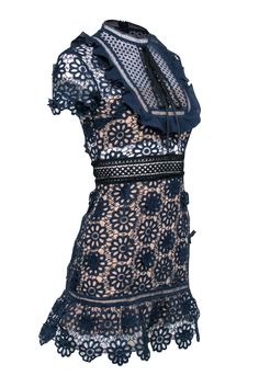 Ready to make a statement at your next cocktail party? Slip into this navy lace eyelet short sleeve dress from Self-Portrait, paired perfectly with black strappy heels. This dress is both elegant and fun, making you the center of attention at any event. Size 2 Shell 97% Polyester, 6% Polyamide Lining 97% Polyester, 3% Spandex Invisible zipper back Short sleeve Semi sheer details Black lace up tie detail Mock neck Ruffle trim Bust 34" Waist 27" Shoulder to hem 33" Sleeve length 7" Eyelet Shorts, Black Strappy Heels, Center Of Attention, Buy Shoes Online, Navy Lace, Neck Ruffle, Short Sleeve Dress, Touch Up, Strappy Heels