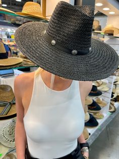 Our Bandera straw hat fits in perfectly with your spring and summer wardrobe, whether at the pool, beach or a concert! On trend w/ a western vibe, classic, chic - everything you've ever wanted in a hat. Featuring a molded crown with a pinched 10cm brim and hand woven straw, it's embellished with a faux leather and silver antique button trim. Finished off with a tassel at the back. -Rancher style hat with a chill & casual vibe-Brim is flexible but holds its shape-Coordinating faux leather band-Pi Spring Rodeo Fedora Straw Hat, Spring Rodeo Straw Hat With Short Brim, Western Style Straw Fedora Hat For Spring, Western Style Fedora Straw Hat For Spring, Western Style Fedora Sun Hat For Spring, Western Sun Hat For Spring Vacation, Western Style Sun Hat For Spring Vacation, Western Style Brimmed Straw Hat For Spring, Fedora Sun Hat For Spring Rodeo