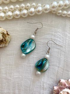 These dangle earrings would make a gorgeous addition to anyone's collection. Elegant Round Beach Earrings, Elegant Nickel-free Earrings For The Beach, Elegant Nickel-free Beach Earrings, Elegant Dangle Beaded Earrings For Beach, Elegant Beaded Dangle Earrings For Beach, Elegant Turquoise Earrings For Beach, Elegant Teardrop Beaded Earrings For Beach, Blue Bohemian Pearl Drop Earrings, Blue Pearl Drop Bohemian Earrings