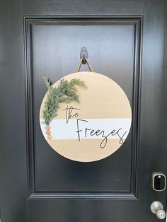 a door with a sign that says the freezers on it