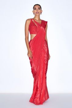 Red pre draped saree featuring cutdana embroidery and attached lining. Paired with a sleeveless padded blouse with a one-shoulder neckline and back hook closure., Fit: Relaxed Red Pre-draped Saree For Party, Red Pre-draped Saree For Festive Evening, Fitted Red Pre-draped Saree For Party, Red Pre-draped Saree With Zari Work For Evening, Party Saree With Cutdana And Draped Style, Evening Pre-draped Red Saree With Zari Work, Evening Red Pre-draped Saree With Zari Work, Draped Saree For Evening Festivals, Evening Saree For Festivals, Draped Style