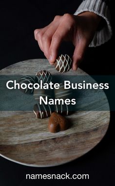 someone is decorating some chocolates on a plate with the words chocolate business names