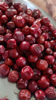 cranberries in a glass bowl on a table