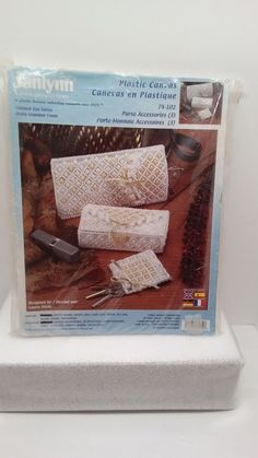 the package includes two crocheted clutches and one knitted purse with matching knitting needles