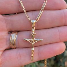 Embrace Timeless Style And Faith With Our Rustic Cross Necklace, Featuring A Uniquely Crafted Cross With A Diamond Cut Design That Adds A Touch Of Brilliance To Its Rugged Charm. Paired With A Classic Valentino Chain, This Necklace Is Both Versatile And Elegant, Making It A Perfect Accessory For Both Men Product Details Material: 14k Gold Filled Metal Purity: 14k Chain Size: 24" Inches Chain Thickness: 2.3mm Pendant Size: 33x18mm Chain Style: Figaro Link Gender: Male Clasp Type: Lobster Claw Age Men’s Crucifix Necklace, Jewelry Men Gold, Mens Gold Cross Necklace, Necklace Men’s Gold, Aesthetic Chains Men, Gold Mens Jewelry, Jewelry Men Aesthetic, Cross Chain Men, Men’s Jewelry