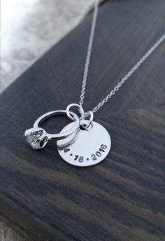 An adorable gift for her!   A 5/8 sterling silver disc is personalized with your anniversary date and hangs next to an engagement ring charm on an 18 sterling silver chain. Any important date of yours can be stamped on the necklace - wedding, engagement, first date! Please Personalized Necklaces For Anniversary, Personalized Round Pendant Jewelry For Anniversary, Personalized Jewelry For Anniversary With Round Pendant, Sterling Silver Jewelry With Hallmark For Birthday, Anniversary Gift Jewelry With Engraving For Mother's Day, Anniversary Jewelry With Engraving Option, Silver Birthstone Jewelry For Anniversary, Elegant Stamped Jewelry For Anniversaries, Elegant Stamped Jewelry For Anniversary