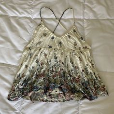 Urban Outfitters Women’s Open Back Crisscross Tank Top. Floral With Key Hole In The Front. Never Worn. Size M But Fits Closer To A Small Summer Rayon Tank Top For Day Out, White Cross Back Tank Top For Summer, Vacation Tank Top With Crisscross Straps, Sleeveless Tops With Crisscross Straps For Vacation, Beach Cami Top With Crisscross Straps, Bohemian Camisole Top With Floral Print, Bohemian Floral Print Camisole Top, V-neck Top With Crisscross Straps For The Beach, Urban Outfitters Tank Top For Summer Vacation