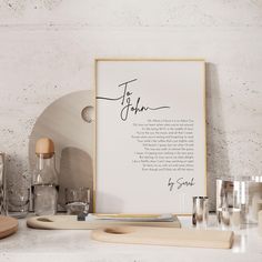 a white framed poster with the words to john written in cursive writing on it