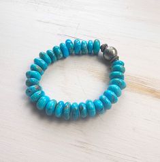 Genuine AZ Kingman turquoise beads. RB lathe turned stainless steel beads. Sterling silver handmade beads. Stretch bracelet. Fits up to 7.5". Turquoise Beaded Bracelets With Silver Beads, Turquoise Stretch Bracelet With Silver Beads, Turquoise Rondelle Hand-strung Beaded Bracelets, Artisan Turquoise Bracelets With Large Beads, Artisan Turquoise Bracelets With Polished Beads, Stretch Beaded Bracelets Diy, Stretch Beaded Bracelets, Jewelry Making Business, Making Bracelets