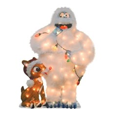 a man in a furry costume standing next to a stuffed animal with christmas lights on it