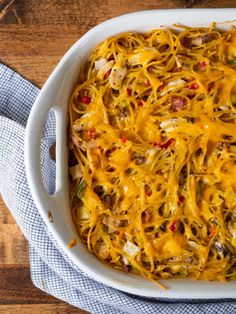 a casserole dish with cheese and vegetables in it