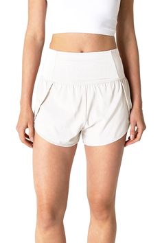 Performance running shorts with a high-rise waistband, complete with an adjustable drawstring on the inside and a zipper pocket on the back. Dolphin, curved hem style shorts with a built in brief liner for added coverage. CARE | Hand Wash Cold CONTENTS | Body & Liner: 90% Polyester, 10% Spandex MEASUREMENTS | 14"/35 cm Top to Bottom, 2.5"/6 cm Inseam (Size Small) MODEL | 5'8 - wearing a size Small IMPORTED Track Running, Style Shorts, Hem Style, Running Shorts, Zipper Pocket, Casual Shorts, Short Dresses, Built In, High Rise