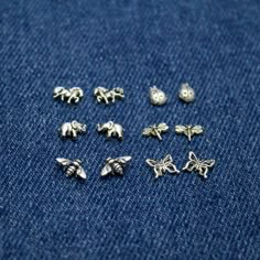 Cute Animal & Insect Studs in Sterling Silver Bumblebee, Lady Bugs, Butterfly, Horses, Elephants and Dragonfly, Minimalist Stud Earrings Cute sterling silver studs, petite that can be used everyday. In this photo, I have bumblebees, lady bugs, butterflies, horses, elephants and dragonflies. Price is for 1 pair. Comes on a card. Request giftwrap ($4) or a box at checkout (this is to save on packaging for customers who are not gifting). How to order: Add the item to your cart. Choose your opti Insect Earrings, Bug Earrings, Minimalist Stud Earrings, Grunge Jewelry, Cute Stud Earrings, Minimalist Earrings Studs, Stud Earrings Silver, Jewelry Tattoo, Minimalist Studs