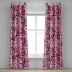 a pink curtain with flowers on it in front of a window